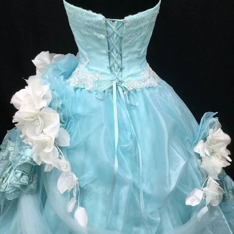 Light blue strapless ball gown with a cinched waist and a voluminous puffy skirt; bridal gown R7301