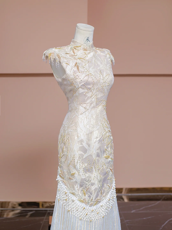 Light champagne-colored sleeveless, fitted ball gown/bridal dress with a Chinese neckline R8346