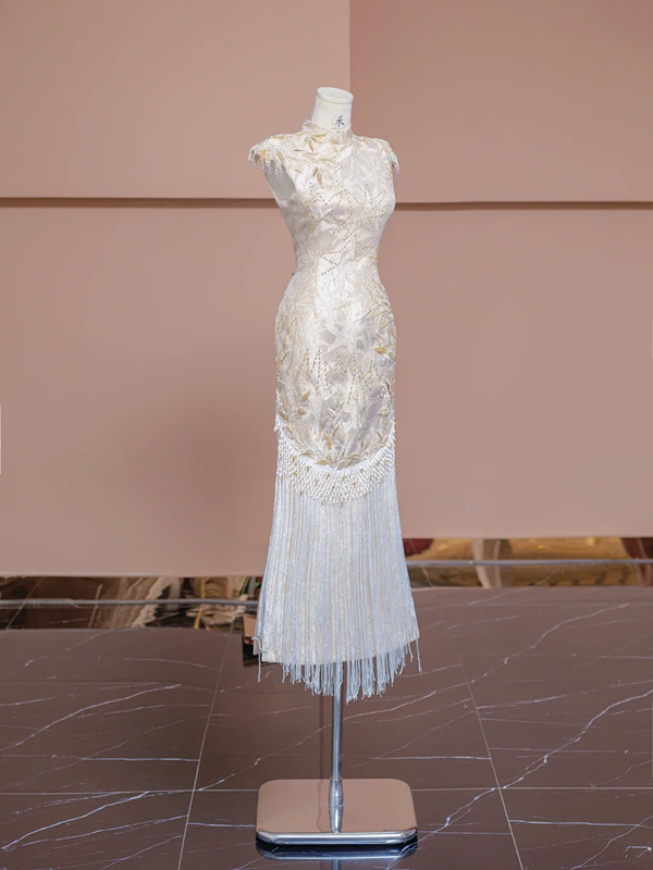 Light champagne-colored sleeveless, fitted ball gown/bridal dress with a Chinese neckline R8346