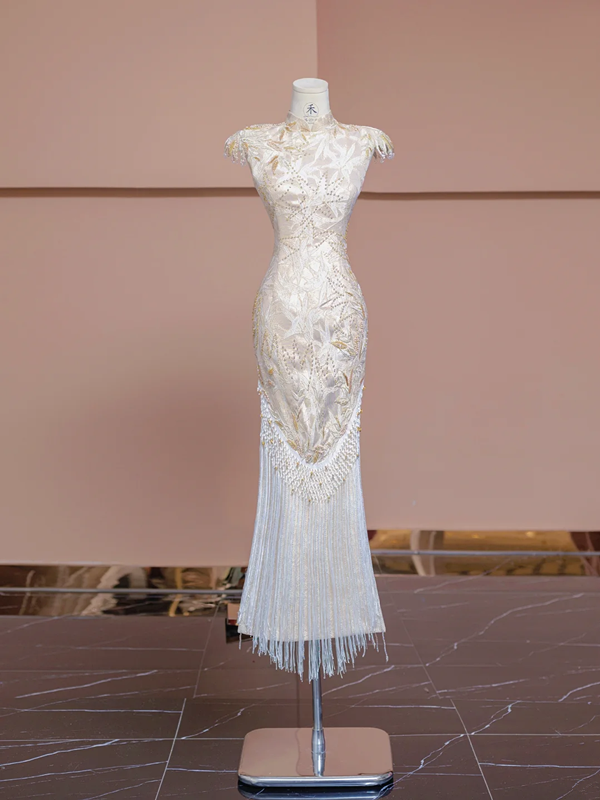 Light champagne-colored sleeveless, fitted ball gown/bridal dress with a Chinese neckline R8346