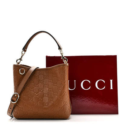 GG Calfskin Embossed Emblem Small Bucket Bag Brown