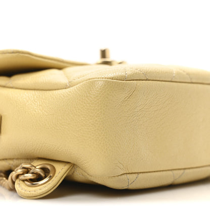 Shiny Caviar Quilted Chain Melody Backpack Yellow