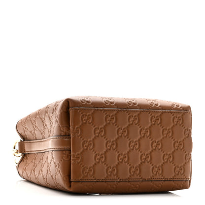 GG Calfskin Embossed Emblem Small Bucket Bag Brown